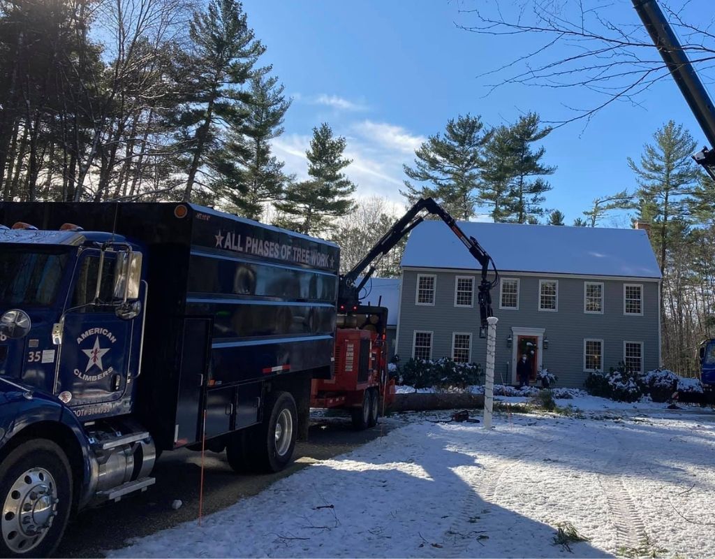 American Climbers works on a residential property in Massachusetts during the winter.