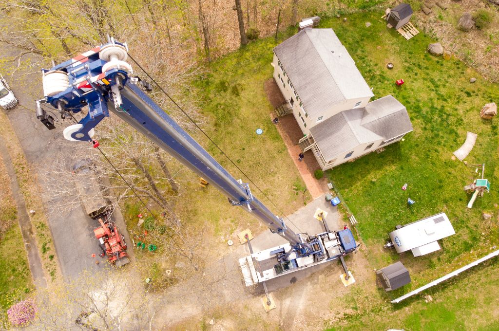 An American Climbers crane as seen from above in a drone shot over. a Massachusetts property.